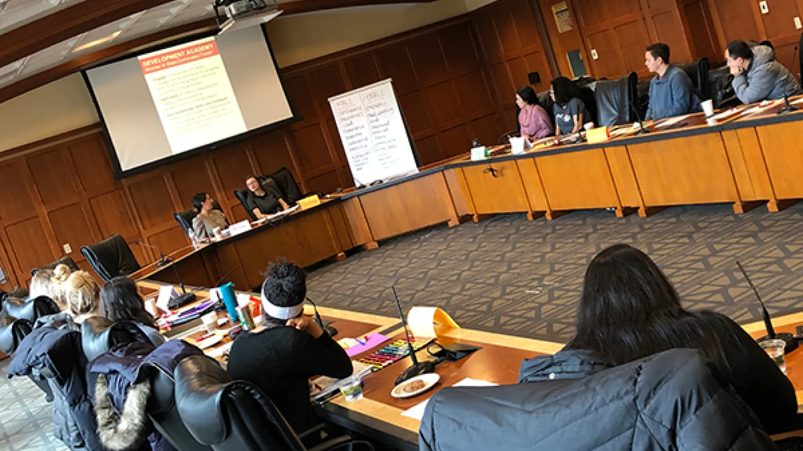 A group of students listens to speakers during a Development Academy focused on women in male-dominated fields.