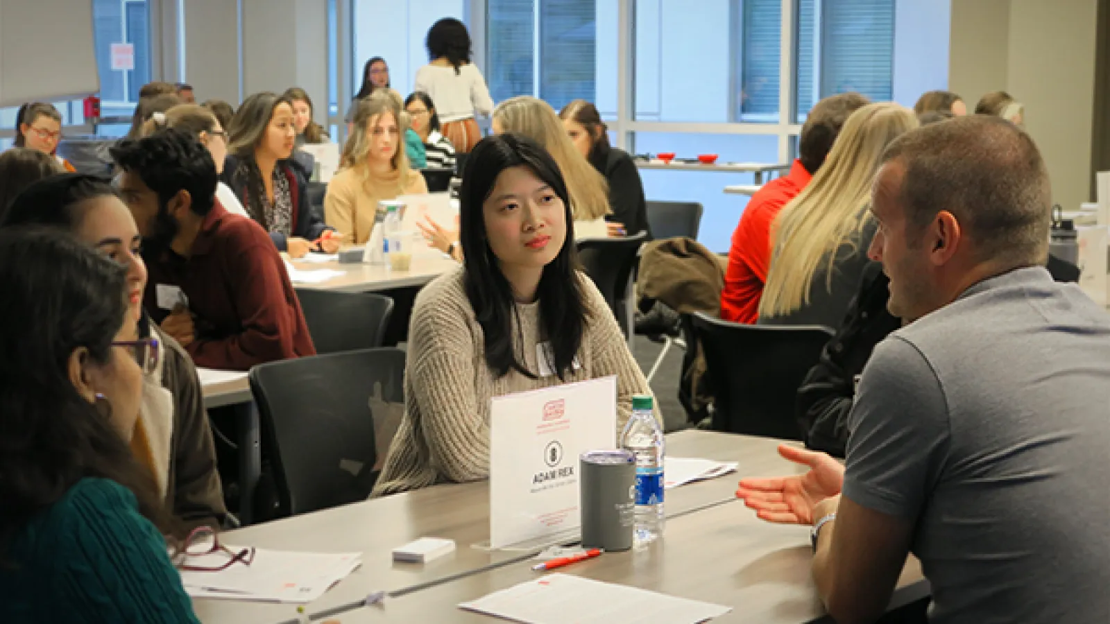 A student talks with an alumni at a Life Beyond Degree event
