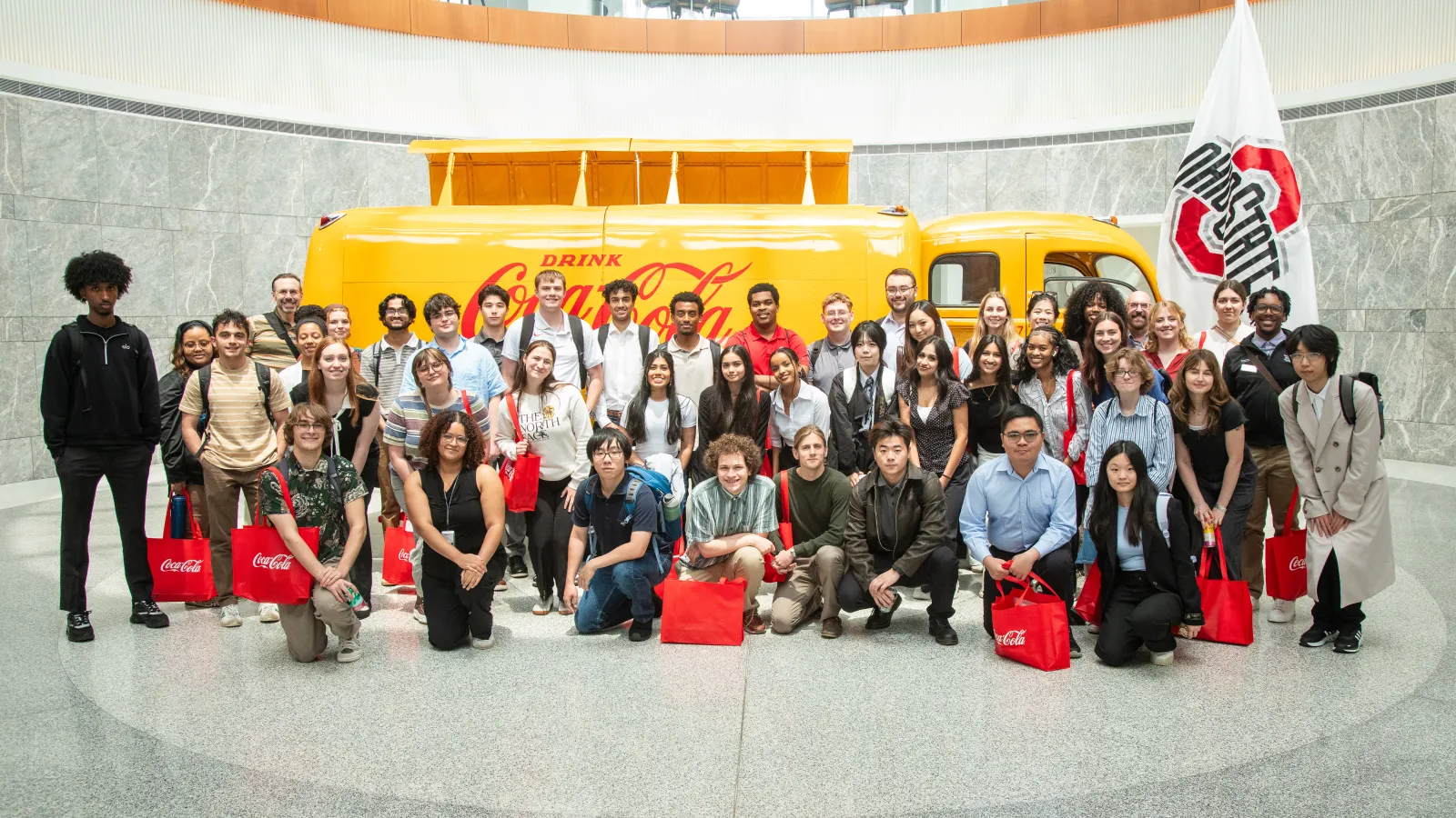 Students standing in front of the yellow Coca Cola truck at their Atlanta HQ.